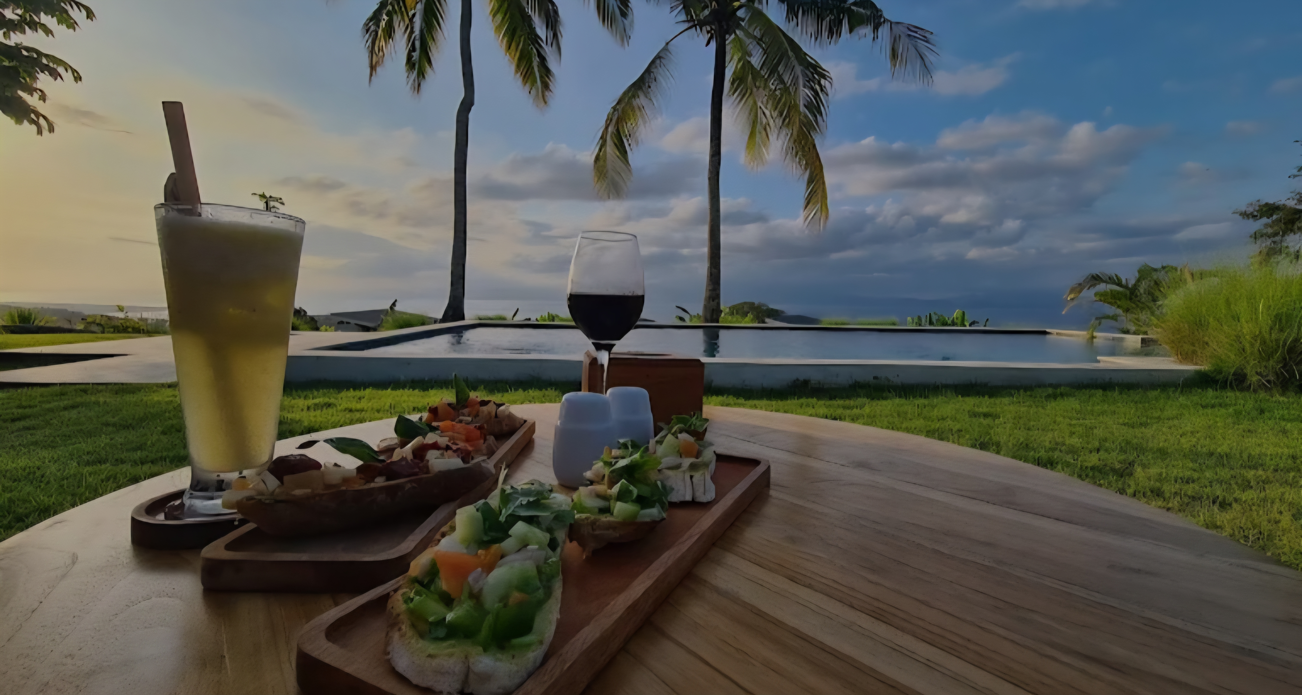 Eden Bar Lounge at sunset with Mount Agung on the horizon