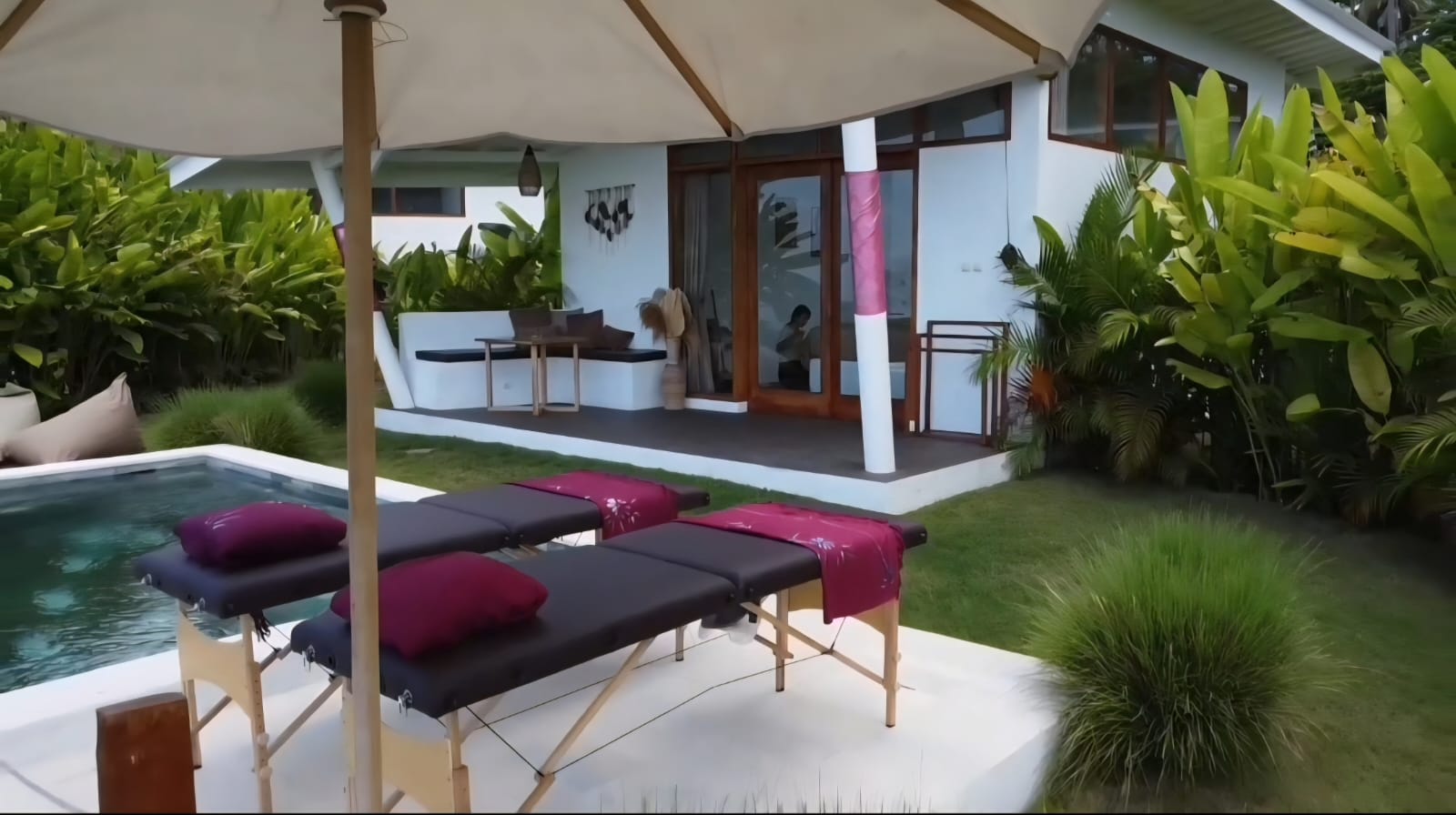 Open-air spa bath with frangipani flowers overlooking the jungle valley